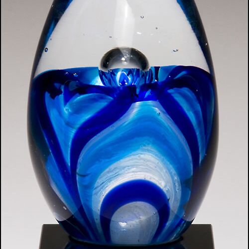 JDS 1633-  Art glass egg with blue and white accents on black glass base 1633 1633-  Art glass egg with blue and white accents on black glass base Thumbnail
